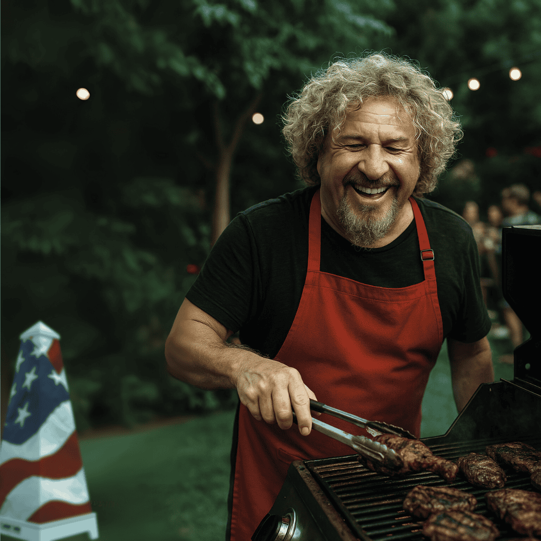 Smiling man with curly blond hair wearing a red apron grilling meat at a backyard BBQ, with a XOUNTS speaker wrapped in an American flag design in the background.